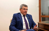 Cyprus' Minister of Energy, Commerce and Industry George Papanastasiou speaks during an interview with Reuters at his office in the ministry in Nicosia