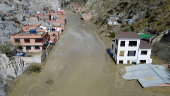 Drone picture shows flooded buildings in the aftermath of landslides caused by intense rains and illegal earth movements, in the Inca Llojeta area