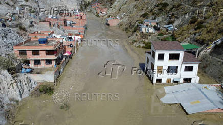 Drone picture shows flooded buildings in the aftermath of landslides caused by intense rains and illegal earth movements, in the Inca Llojeta area