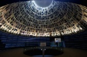 Visitors tour an exhibition ahead of Israel's national Holocaust memorial day, at Yad Vashem in Jerusalem