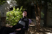 First-time voter Yeshua Loya, 21, poses for a portrait at The Plaza assisted living facility in Scottsdale