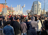 People gather as they celebrate, after Syrian rebels announced that they have ousted President Bashar al-Assad, in Tripoli, northern Lebanon