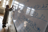 Students in a classroom after authorities announced the reopening of schools, in Damascus