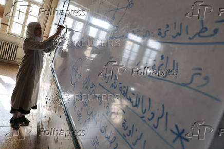 Students in a classroom after authorities announced the reopening of schools, in Damascus