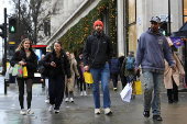 Shoppers walk on Oxford Street in London