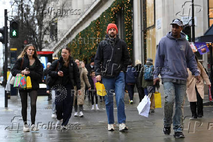 Shoppers walk on Oxford Street in London