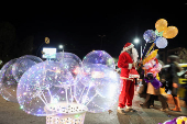 Syrian street vendor dressed as Santa Claus in Damascus