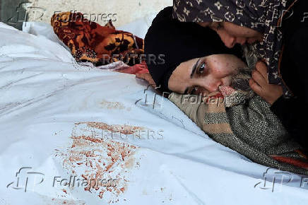 Funeral of Palestinians killed in Israeli strikes at Al-Aqsa Martyrs Hospital in Deir Al-Balah in the central Gaza Strip