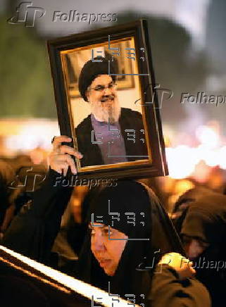 Supporters of Hezbollah Brigades protest against the killing of Nasrallah, in central Baghdad