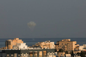 Smoke rises on the Israeli side of the border with Lebanon, in the northern city of Nahariya