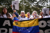 Relatives of detained Venezuelans protest, outside the public prosecutor's headquarters, in Caracas