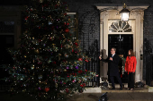 British Prime Minister Starmer and his wife switch on the Downing Street Christmas tree lights, in London