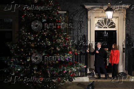 British Prime Minister Starmer and his wife switch on the Downing Street Christmas tree lights, in London