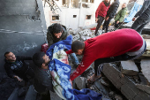 Aftermath of Israeli strike on a house in Nuseirat, in the central Gaza Strip