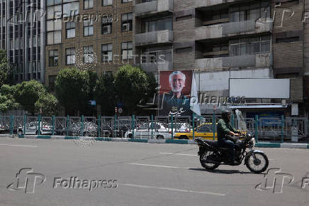 A banner of presidential candidate Saeed Jalili ?is displayed on a street in Tehran