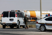 Israeli soldier patrols the area near Allenby Bridge Crossing between the West Bank and Jordan following a shooting incident at the crossing in the Israeli-occupied West Bank