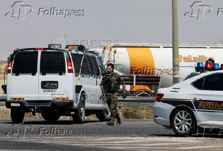 Israeli soldier patrols the area near Allenby Bridge Crossing between the West Bank and Jordan following a shooting incident at the crossing in the Israeli-occupied West Bank