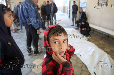 Palestinians mourn loved ones killed in Israeli strikes, in Khan Younis in the southern Gaza Strip