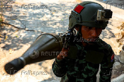 A soldier from the Karen National Liberation Army (KNLA) carries an RPG launcher at a Myanmar military base at Thing Naga Nyi Naung village on the outskirts of Myawaddy