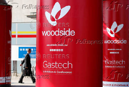 FILE PHOTO: Logos of Woodside Petroleum are seen at Gastech, the world's biggest expo for the gas industry, in Chiba