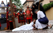 Members of the Italian community take part in a re-enactment of the crucifixion of Jesus Christ on Good Friday in Bensheim