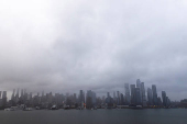 Clouds are pictured over the skyline of New York during a rainy day as it is seen from Weehawken, New Jersey