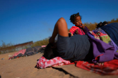 Migrants seeking asylum in the United States gather on the banks of the Rio Bravo river in Ciudad Juarez