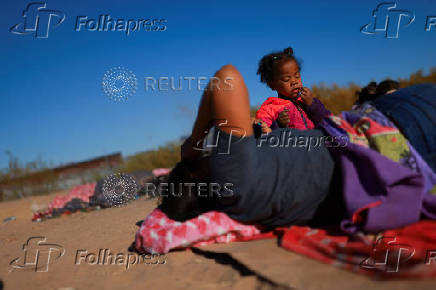 Migrants seeking asylum in the United States gather on the banks of the Rio Bravo river in Ciudad Juarez