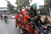 Pakistan's Christian minority dressed up as Santa hold rally in Peshawar