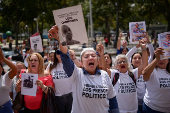 Relatives of detained Venezuelans protest, outside the public prosecutor's headquarters, in Caracas