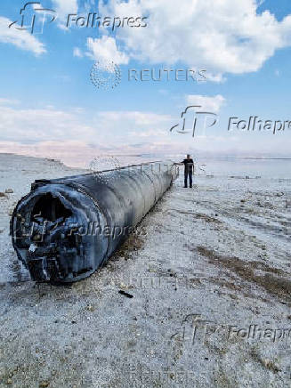 FILE PHOTO: A ballistic missile lies on the shore of the Dead Sea after Iran launched drones and missiles towards Israel