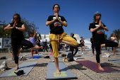 People practice yoga in support of Israeli hostages held in Gaza, in Tel Aviv