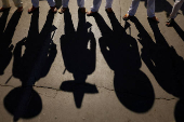 People take part in a parade marking the 114th anniversary of the Mexican Revolution, in Ciudad Juarez