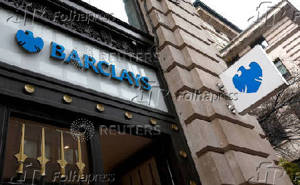 FILE PHOTO: FILE PHOTO: A view shows signage on a branch of Barclays Bank in London