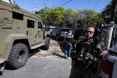 Agents with Homeland Security Investigations (HSI) conduct a search for undocumented migrants in San Juan