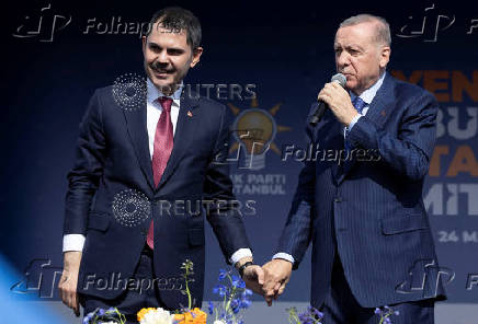 Turkey's President Erdogan and Murat Kurum greet their supporters during a rally in Istanbul