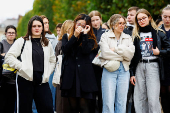 Fans gather and place tributes to former One Direction singer Liam Payne in Paris