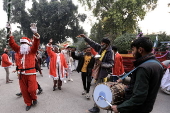 Pakistan's Christian minority dressed up as Santa hold rally in Peshawar