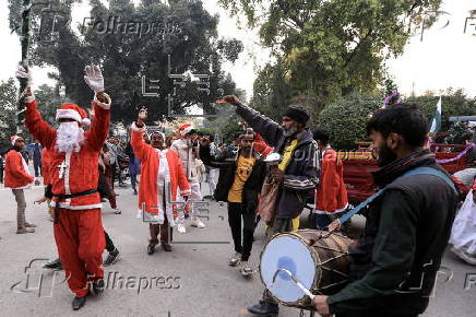 Pakistan's Christian minority dressed up as Santa hold rally in Peshawar