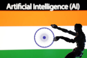 Illustration shows AI Artificial intelligence words, miniature of robot and an Indian flag