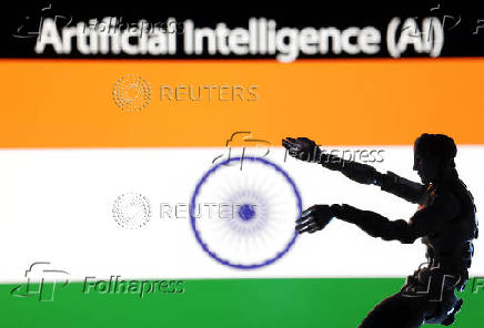 Illustration shows AI Artificial intelligence words, miniature of robot and an Indian flag