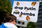 Protesters call for Russian President Putin to go to jail instead of another term in the Kremlin, in The Hague