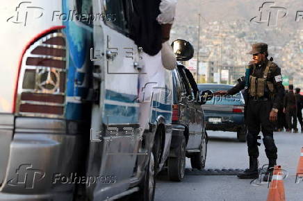 Afghans Taliban conduct checks on people and vehicles at checkpoints in Kabul