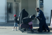 A man pushes a cart with luggage outside Beirut-Rafic Hariri International Airport