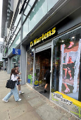 FILE PHOTO: People enter in a Dr. Martens store in Manchester