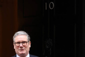 British Prime Minister Keir Starmer walks outside 10 Downing Street in London