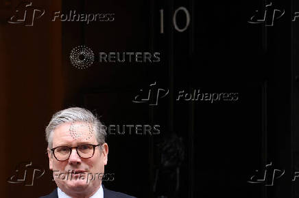 British Prime Minister Keir Starmer walks outside 10 Downing Street in London