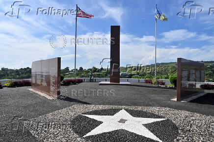 The U.S. flag and the Solomon Islands flag are seen at the Guadalcanal American Memorial in the capital Honiara