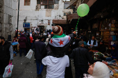 People walk at a traditional souq in the Bab Touma district of the Old City of Damascus