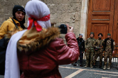 Fighters of the ruling Syrian body pose for a picture in the Bab Touma district of the Old City of Damascus